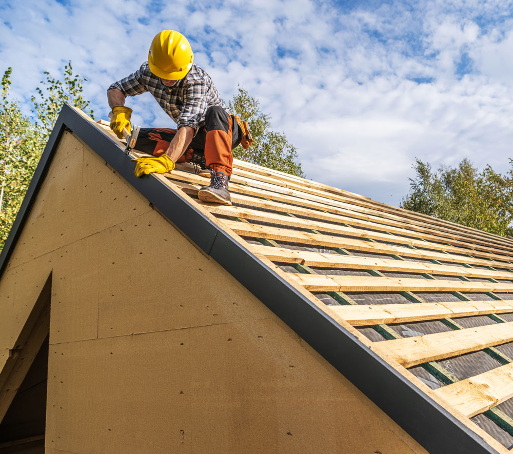 construction-worker-builds-a-home-roof-in-daytime-2026-03-24-04-47-45-utc